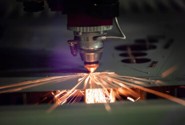 CNC Laser cutting of metal modern industrial technology. Laser cutting works by directing the output of a high-power laser through optics. Laser optics and CNC computer numerical control.