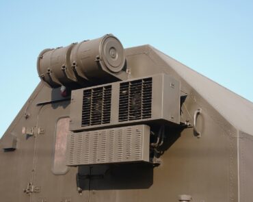Close up view of green military truck. Modern military transportation vehicle technologies