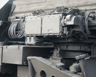 Close up view of green military truck. Modern military transportation vehicle technologies